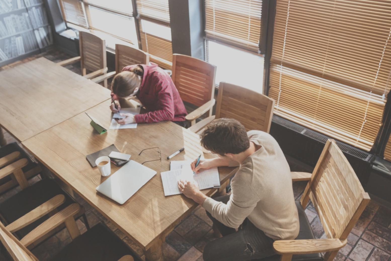 Business planning documents and financial spreadsheets on a desk